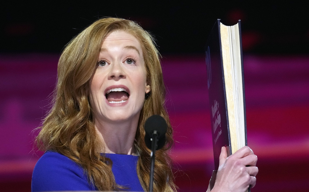 Mallory McMorrow holds up Project 2025 book at 2024 DNC