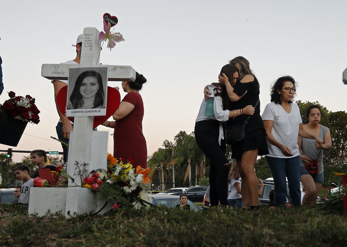 Mother comforts daughter at Parkland memorial from Feb. 18, 2018