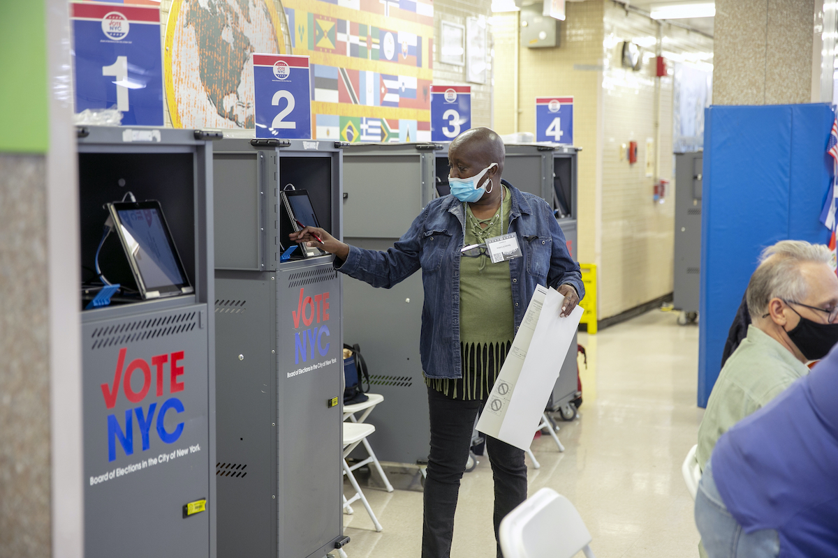 NYC New York poll worker at printing machine 11-1-22