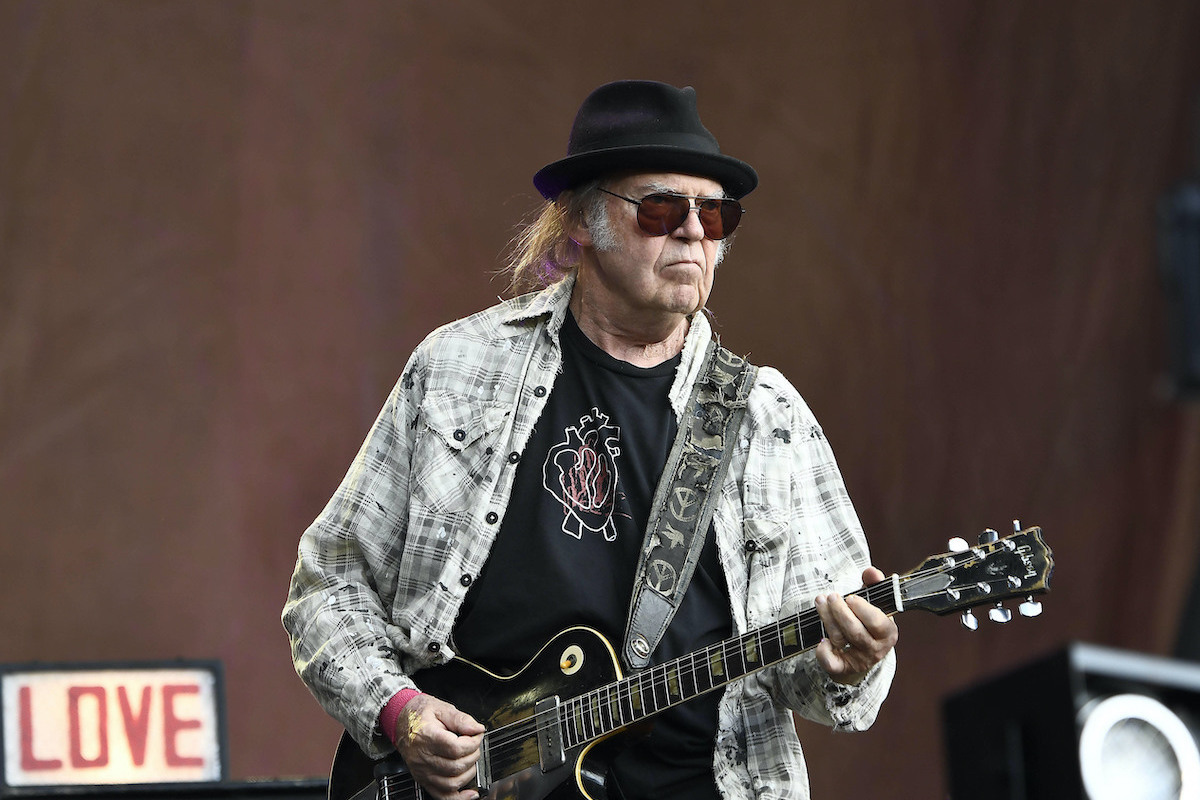 Neil young playing guitar