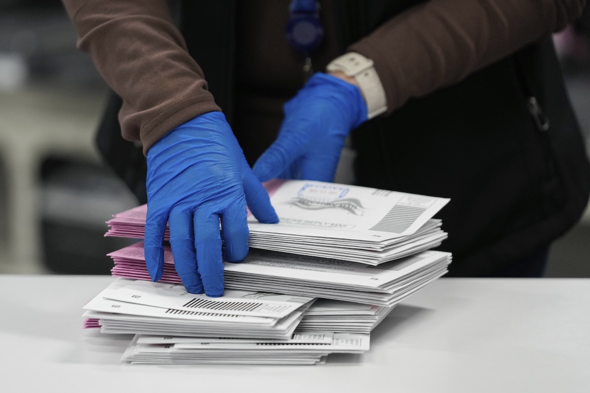 Nevada election official sorts mail-in ballots in Reno, 11-5-2024