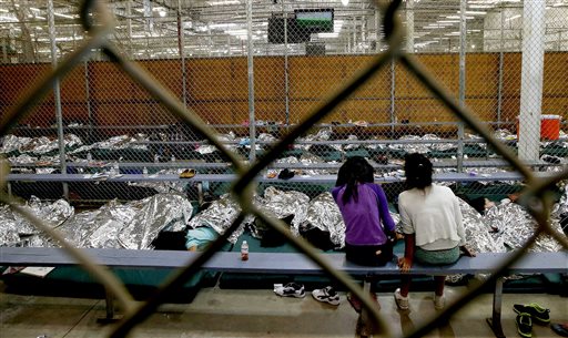 Migrant children watch soccer Nogales, Arizona 2014