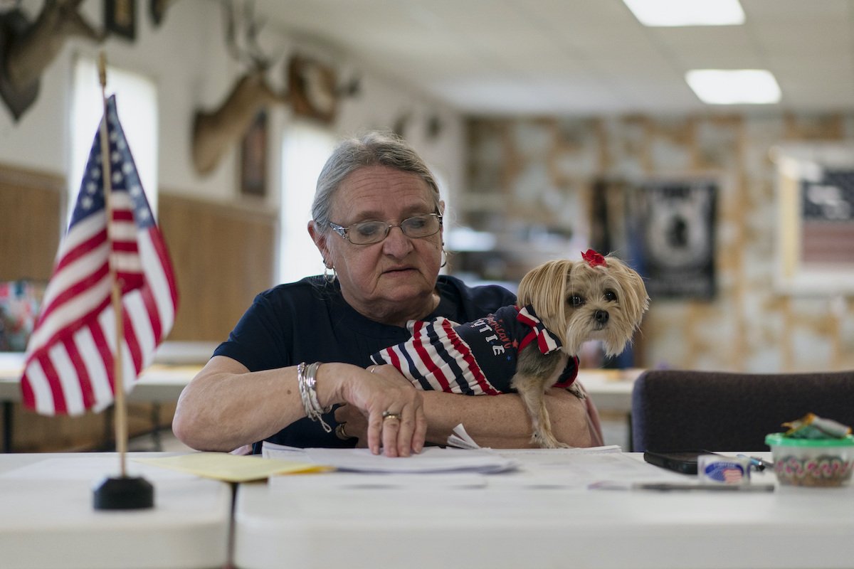 Poll worker in PA with a dog 5-17-22