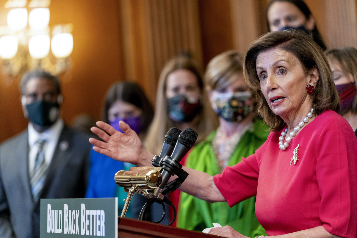 Pelosi with Build Back Better sign at Capitol with Democrats 9-28-21