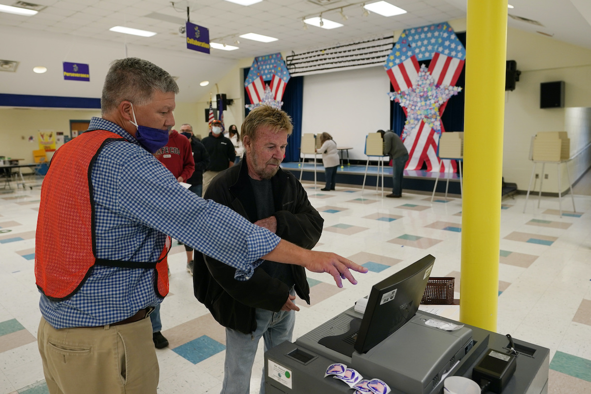 Poll worker helps Virginia voter 11-2-21