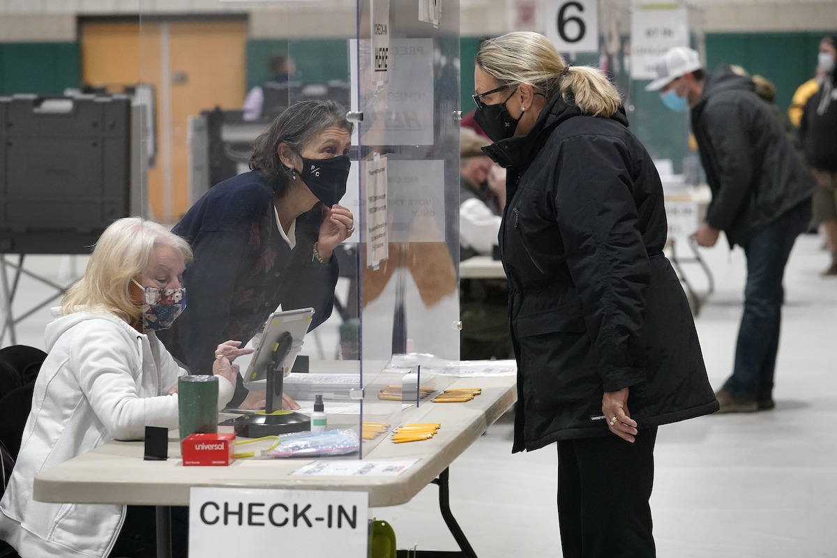 Poll worker in Mass checks in voter 11-3-20