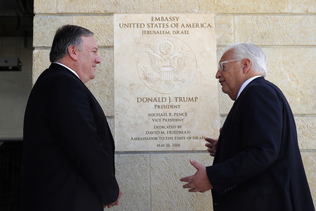 Mike Pompeo meets with diplomat in front of plaque at US embassy in Jerusalem 2019