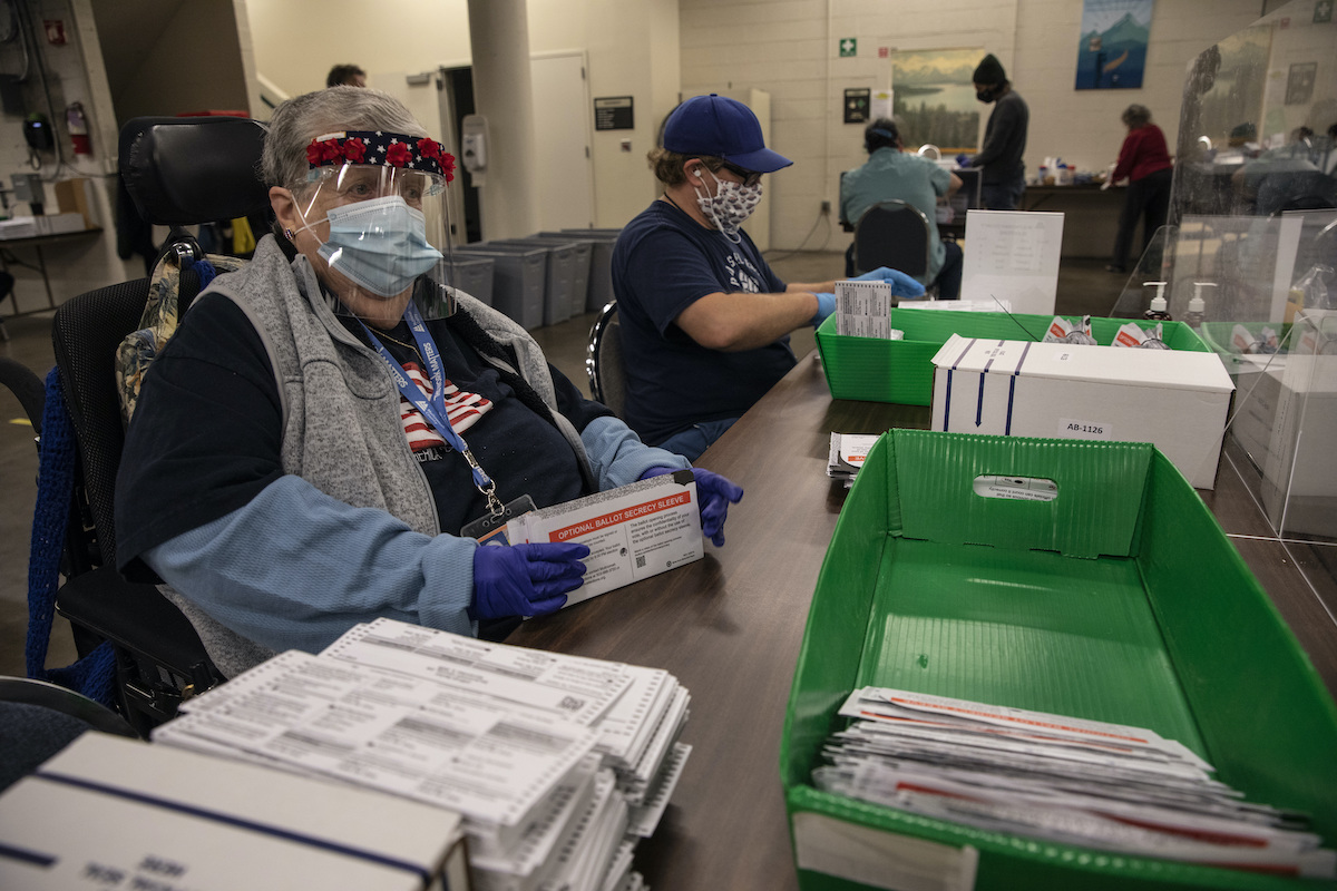 Portland Oregon election worker with ballots 11-3-20