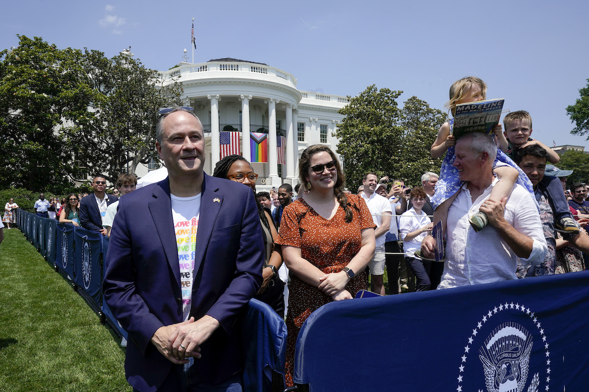 Pride celebration at White House June 10, 2023 with progress pride flag and U.S. flag above it