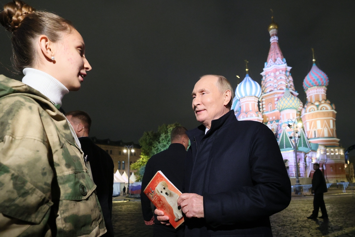 Russian President Vladimir Putin speaks to Donetsk resident on Sept. 30, 2022