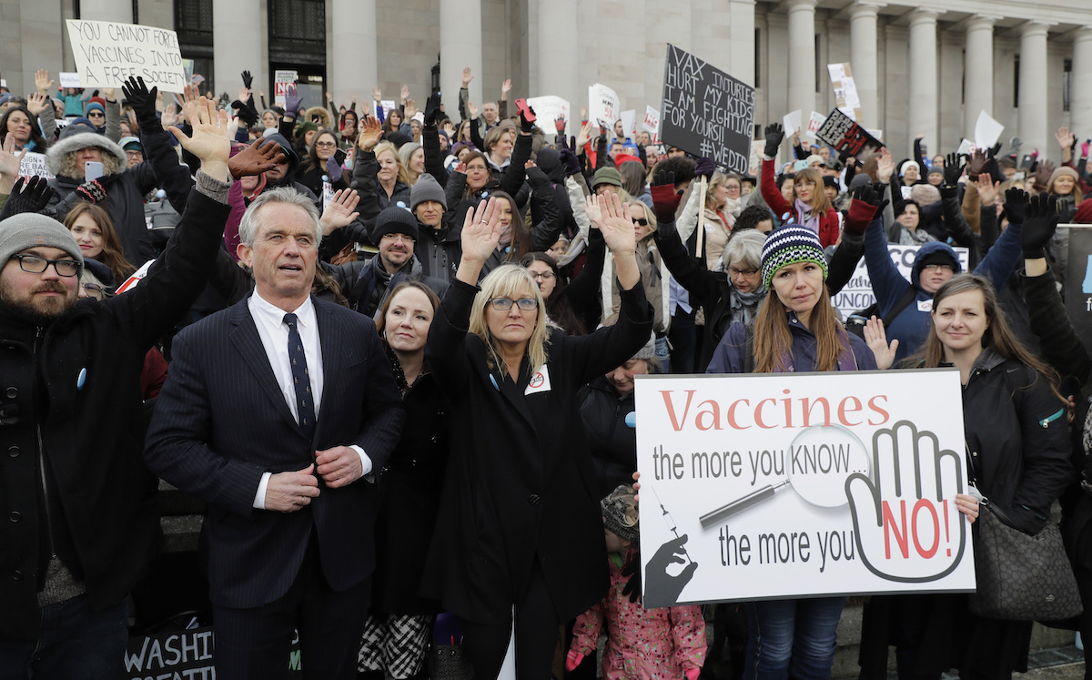 Robert F. Kennedy, Jr., left, stands with anti-vaccine protesters, 2-8-2019