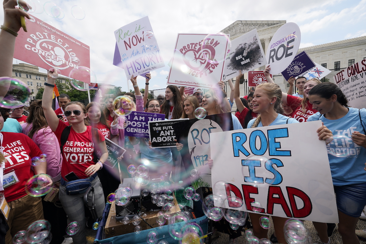 Supreme Court abortion ruling "Roe is dead" sign 6-24-22