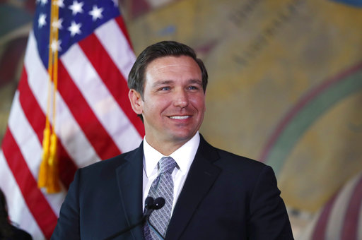 Gov. Ron DeSantis by flag Jan 2019