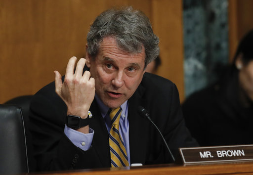 Sherrod Brown at desk in 2018