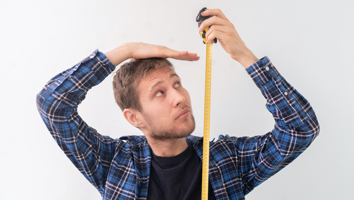Shutterstock - man measuring height