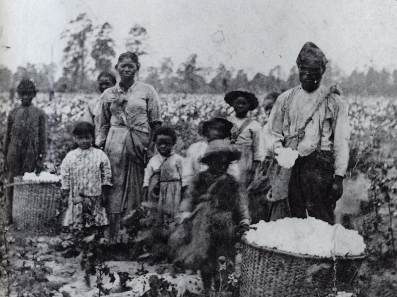 Slavery image, family in field