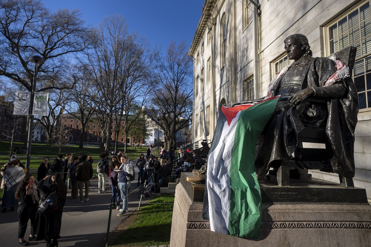 John Harvard statue with Palestinian flag Harvard University campus protest 04-24-2024