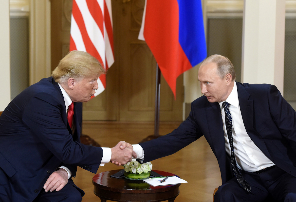 Trump Putin shaking hands seated