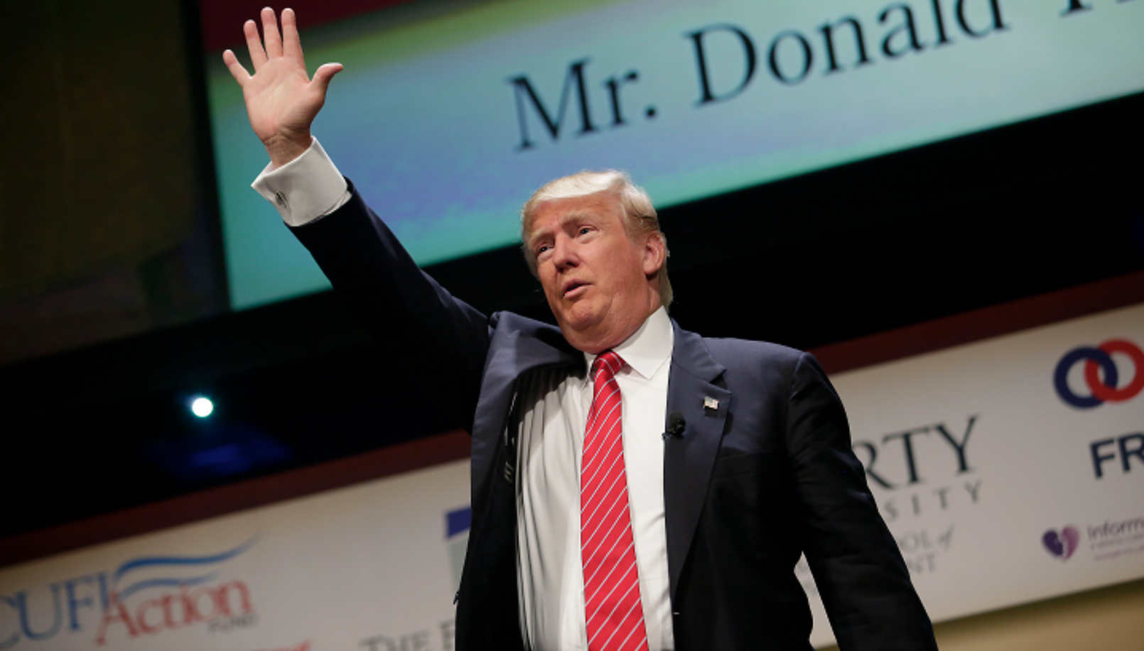 Trump Iowa waves to crowd