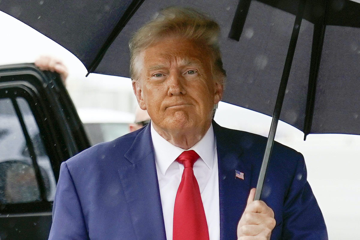 Trump with umbrella in VA 8-3-2023