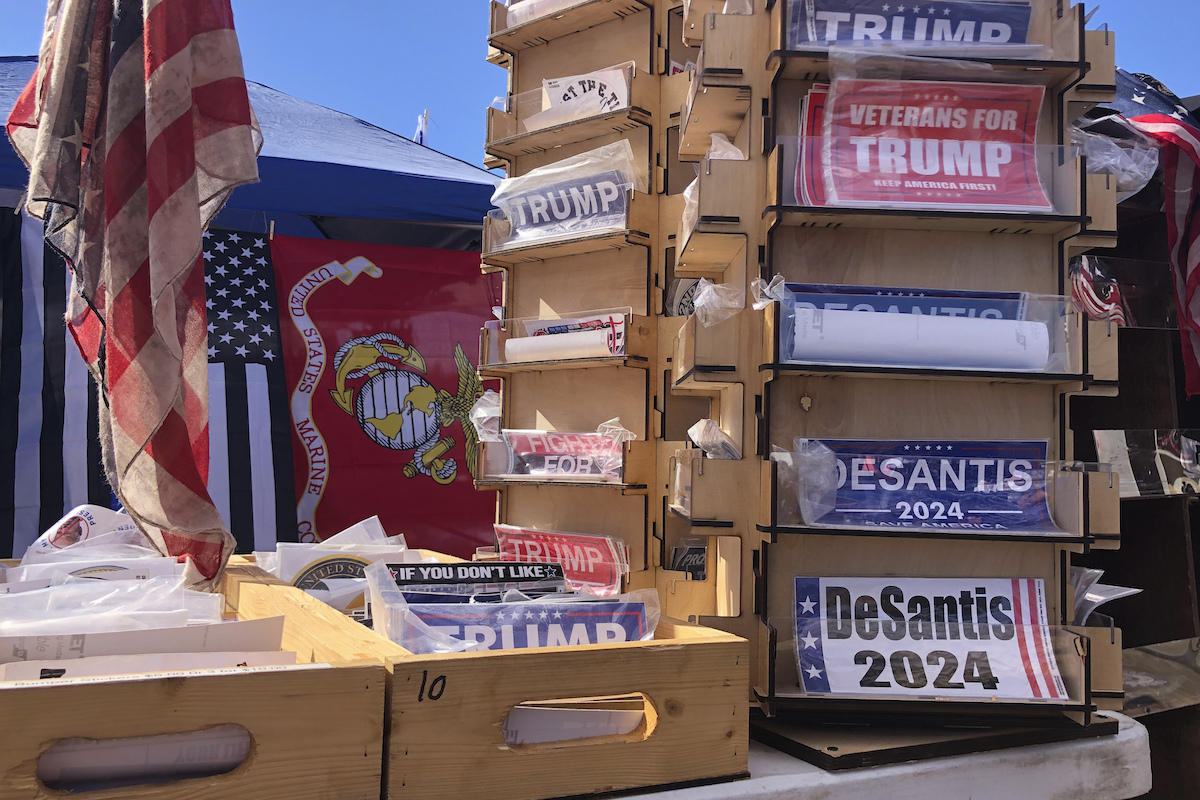 DeSantis and Trump bumper stickers at a 2022 Trump rally in Texas