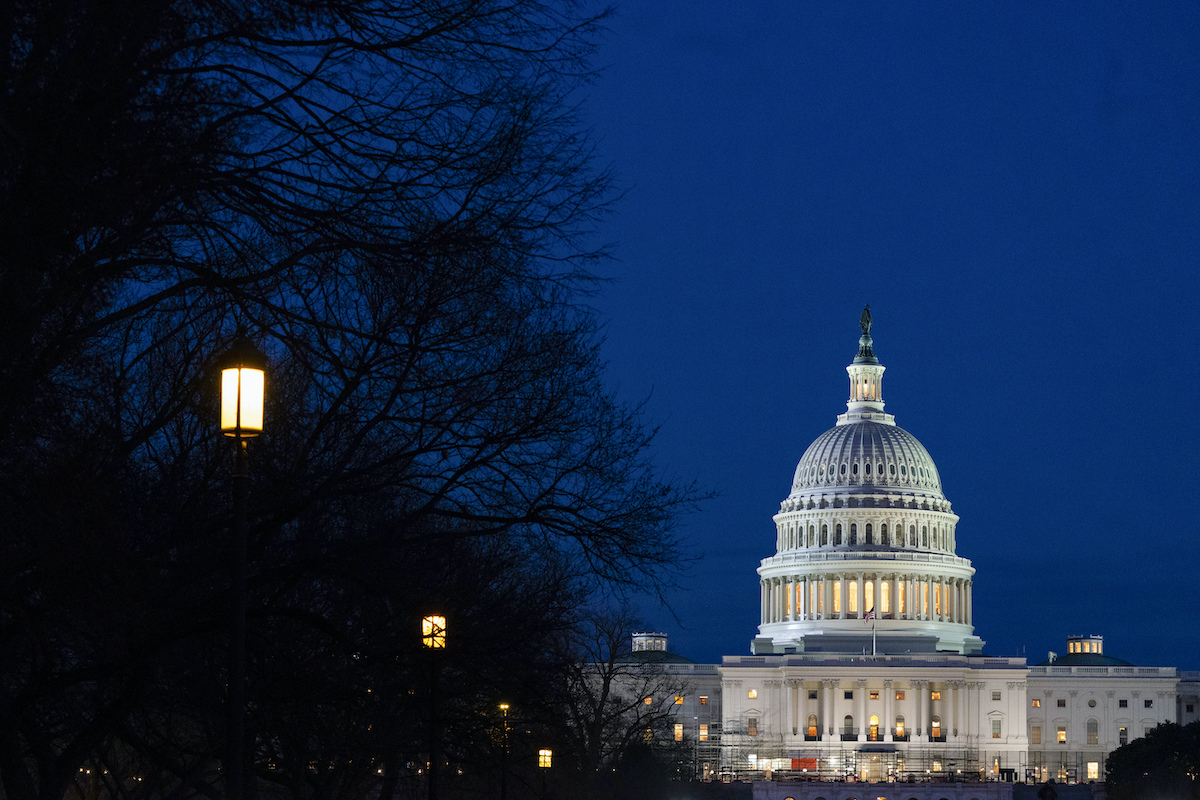 U.S. Capitol at night with building on right side SOTU 3-1-22