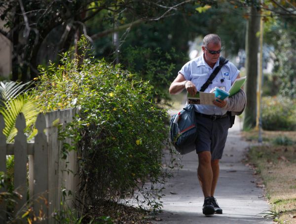 USPS carrier walking