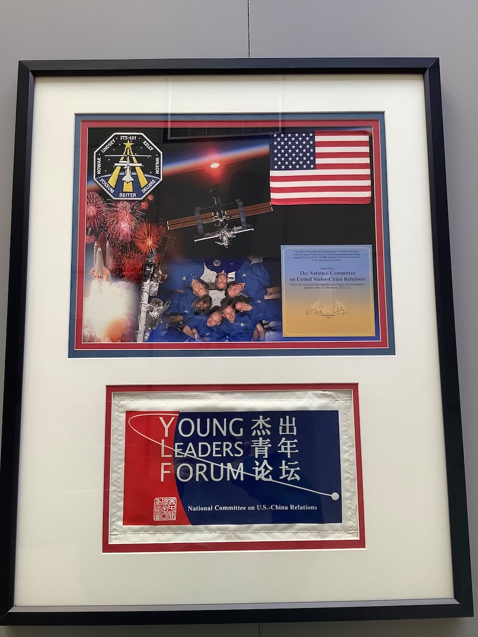 young leaders forum banner and US flag certificate mark kelly banner