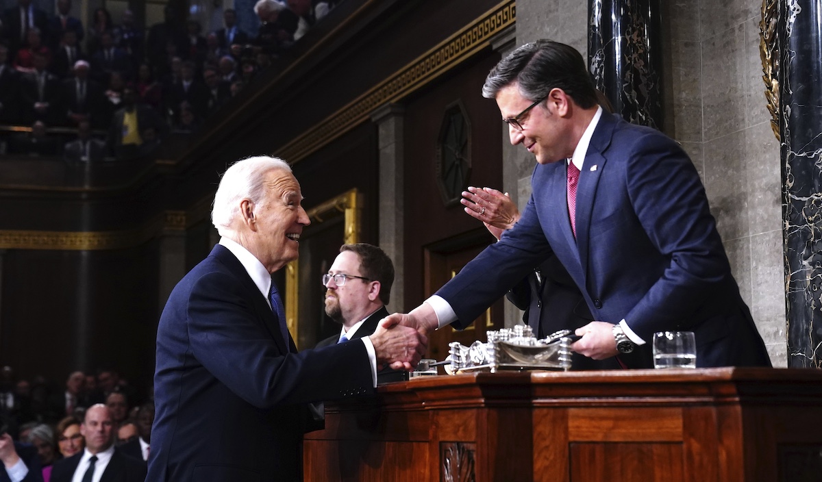 Joe Biden and Mike Johnson shake hands before the State of the Union, 3-7-2024