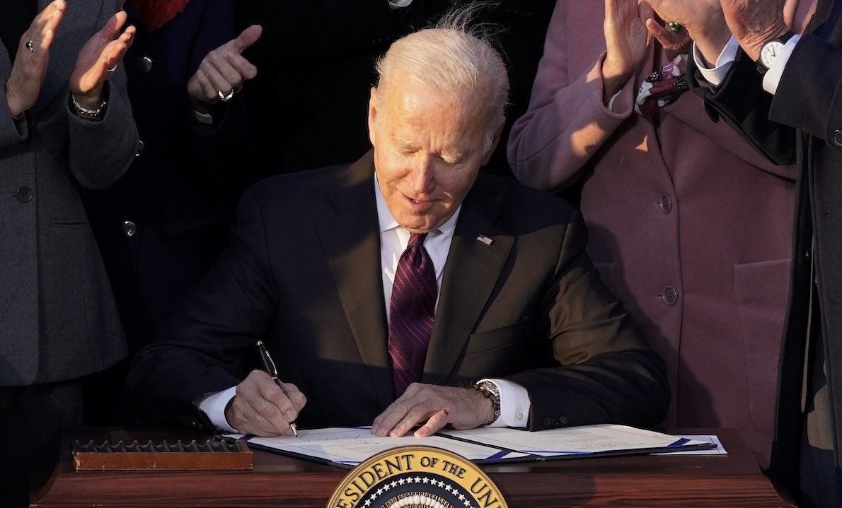 Biden bill signing photo for final Biden Promise Tracker story, 1-9-2025