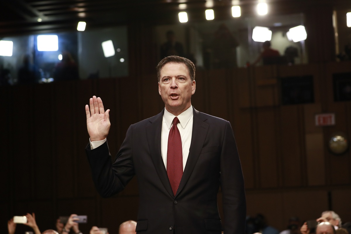 Comey sworn in (hand up)