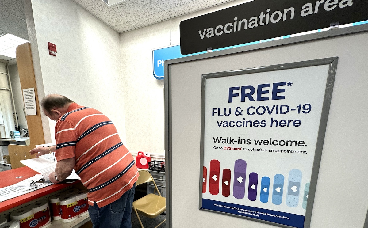 COVD-19 shot sign at Palatine, Ill., pharmacy, 9-13-2023