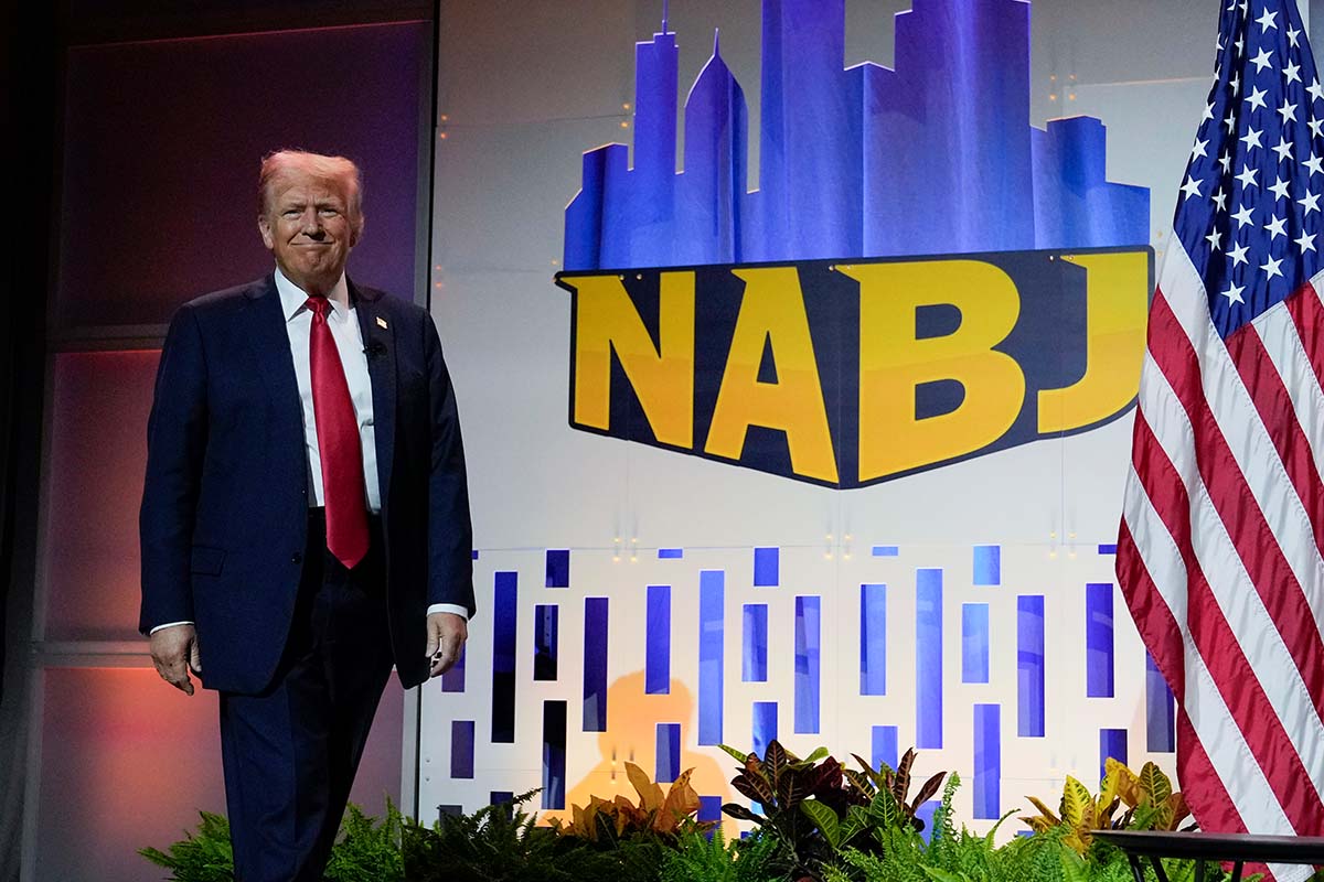 Donald Trump walks onstage at the National Association of Black Journalists convention in Chicago, 7-31-2024