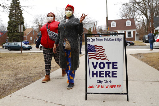 voters with face masks Michigan March 2020