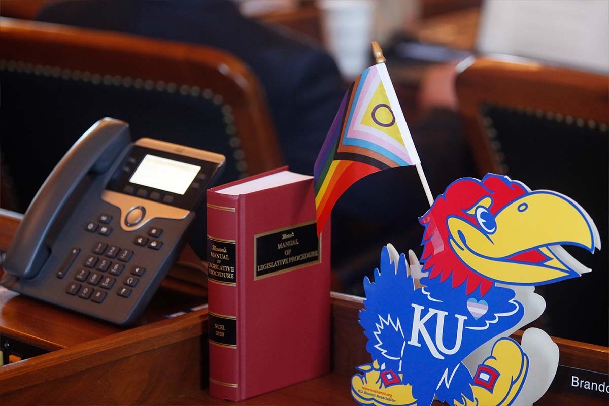 Kansas Legislature with pride flag on desk