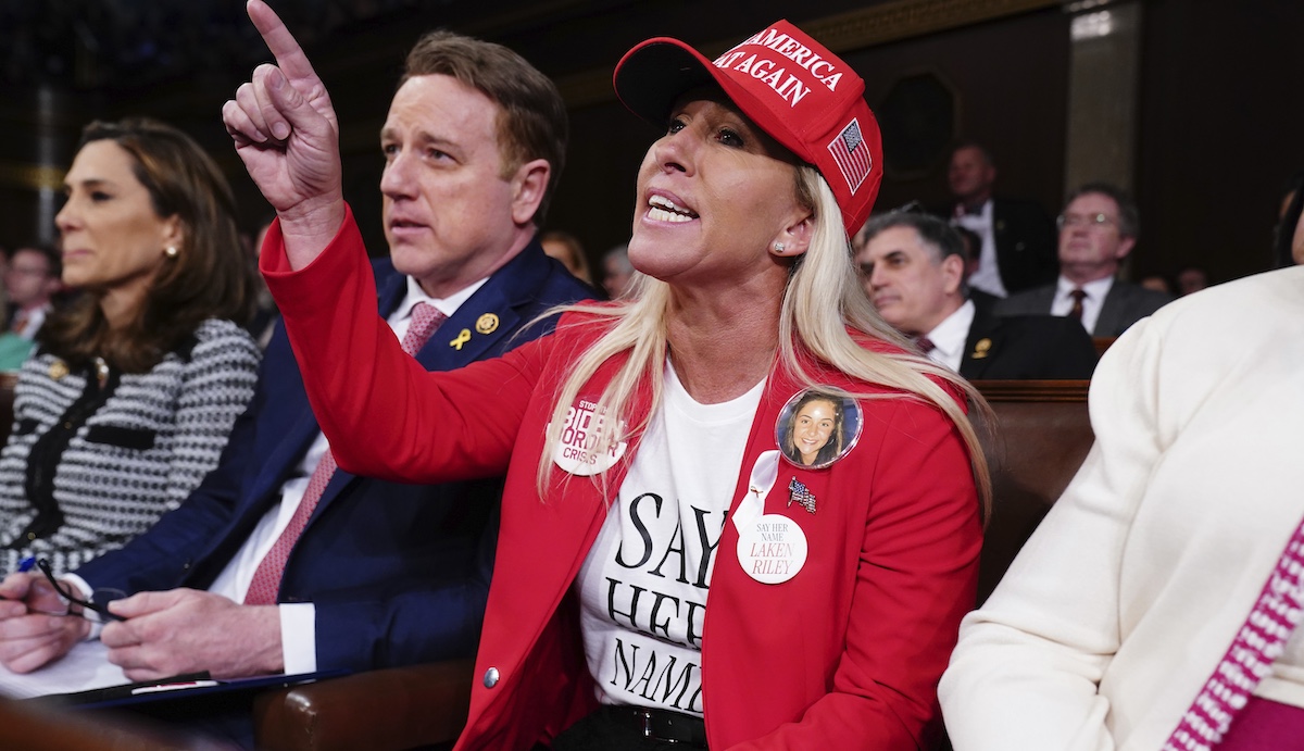 Majorie Taylor Greene shouts at President Joe Biden at the State of the Union address in Washington, 3-7-2024
