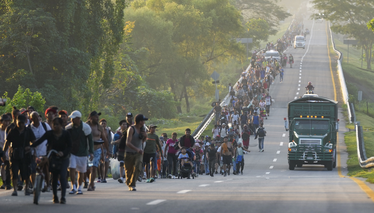 Mexico migrants walk on highway in Huixtla, southern Mexico, 11-7-2024