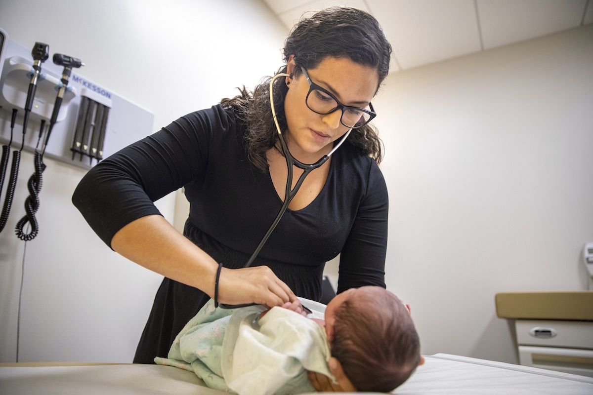 A pediatrician examines a newborn baby at her practice in Chicago, Aug. 13, 2019. (AP)
