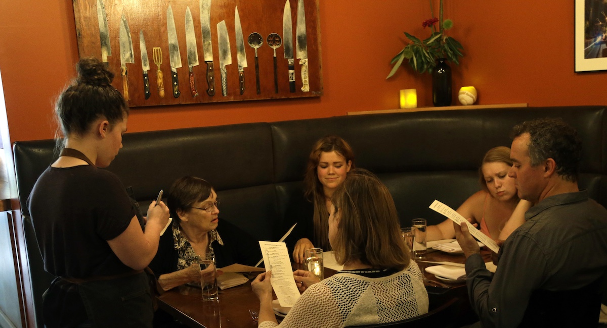 Server takes an order at Portland, Ore., restaurant, 8-8-2016