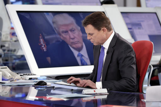 Shepard Smith with Trump on TV screen Jan 2017