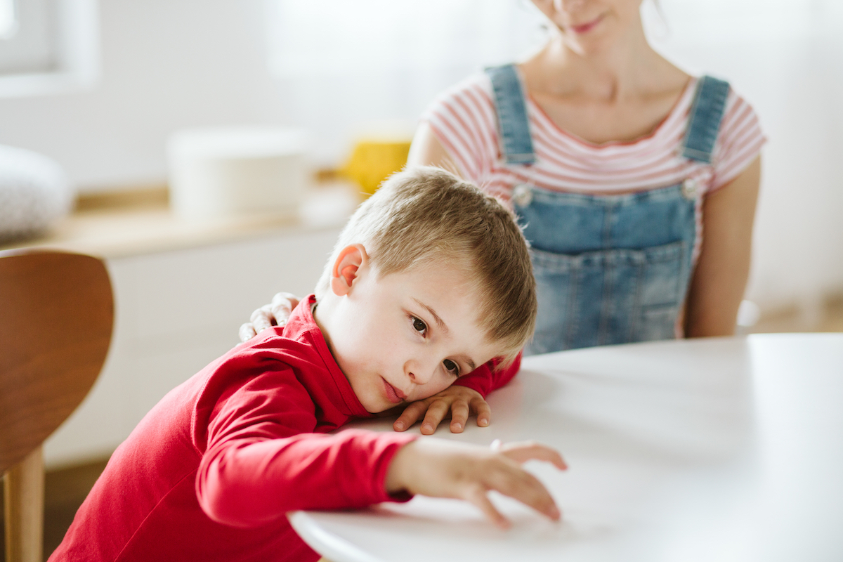 Child with ADHD not paying attention to mother