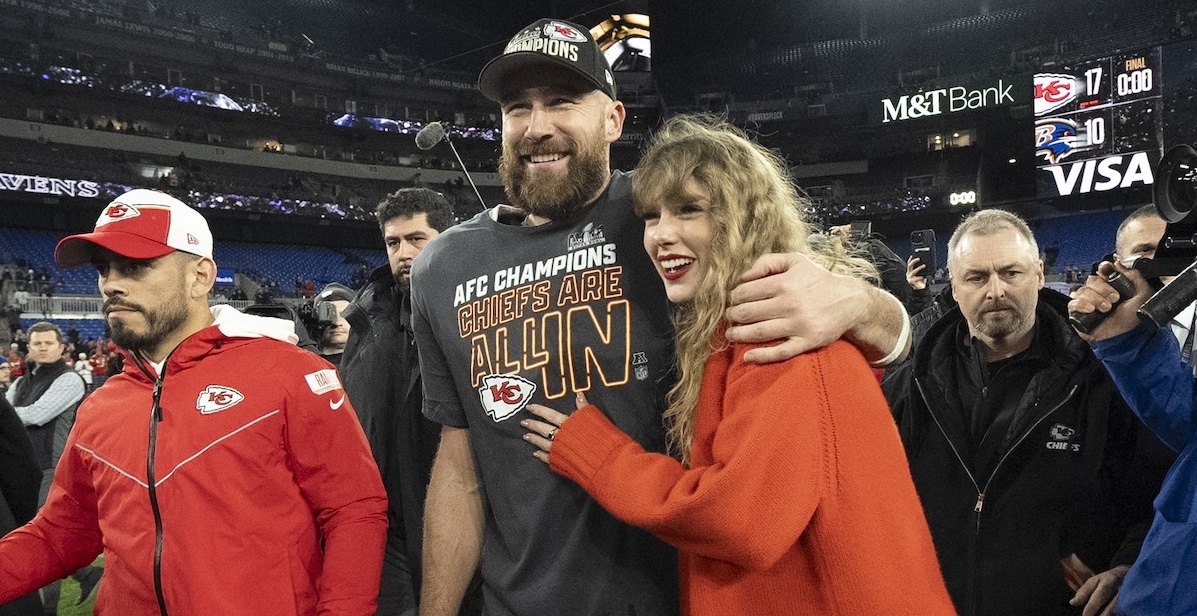 Taylor Swift and Travis Kelce on the field in Baltimore, 1-28-2024