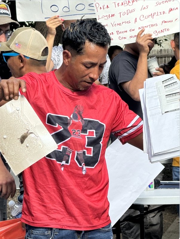 Aurora apartment resident holding mouse trap, 09/03/24