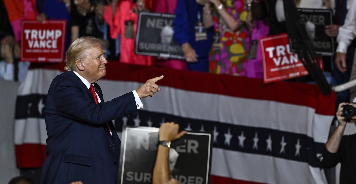Donald Trump points to supporters at Charlotte, N.C., campaign rally, 7-24-2024