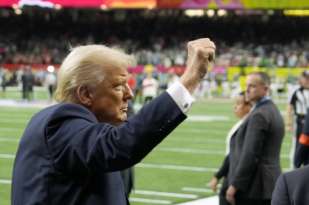 Trump raises fist at Super Bowl 2025 on field in New Orleans, 2-9-2025