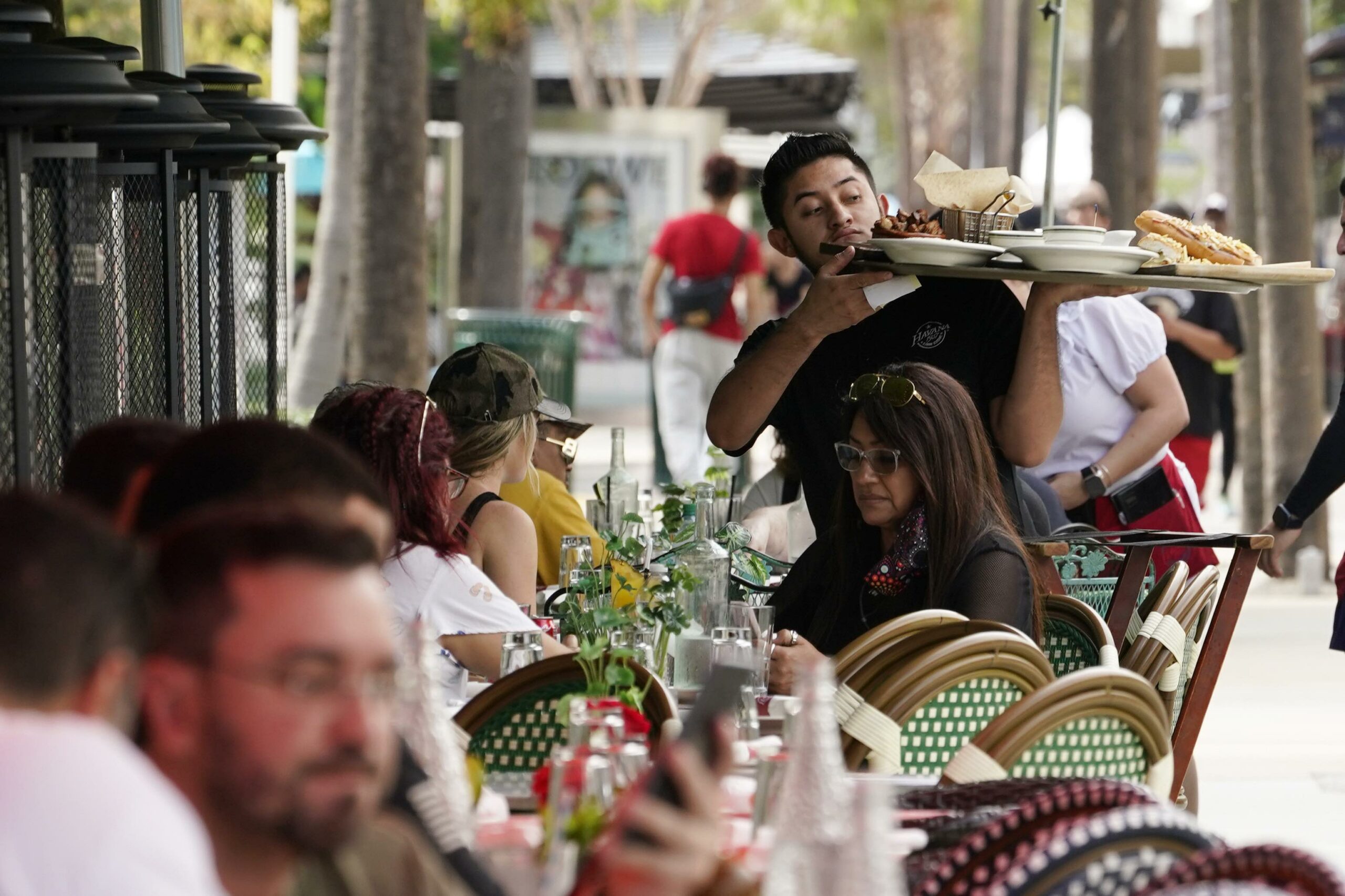 Waiter serving food in Miami Beach., Fla., 1-21-2022