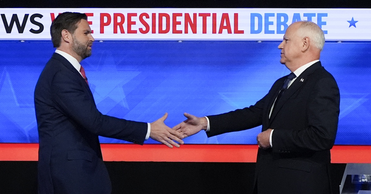 Tim Walz and JD Vance shake hands bwefore their debate in New York, 10-1-2024