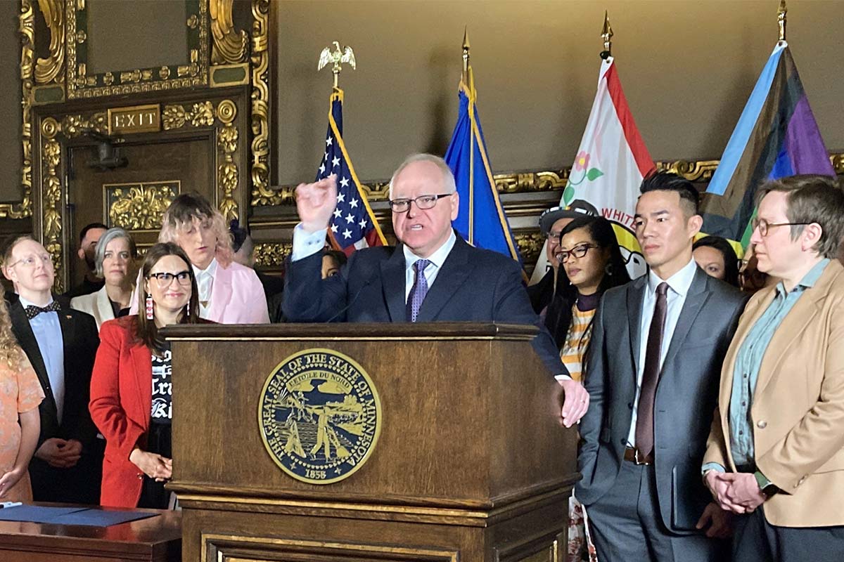 Minnesota Gov. Tim Walks signs gender-affirming care bill in St. Pail, Minn., 3-8-2023