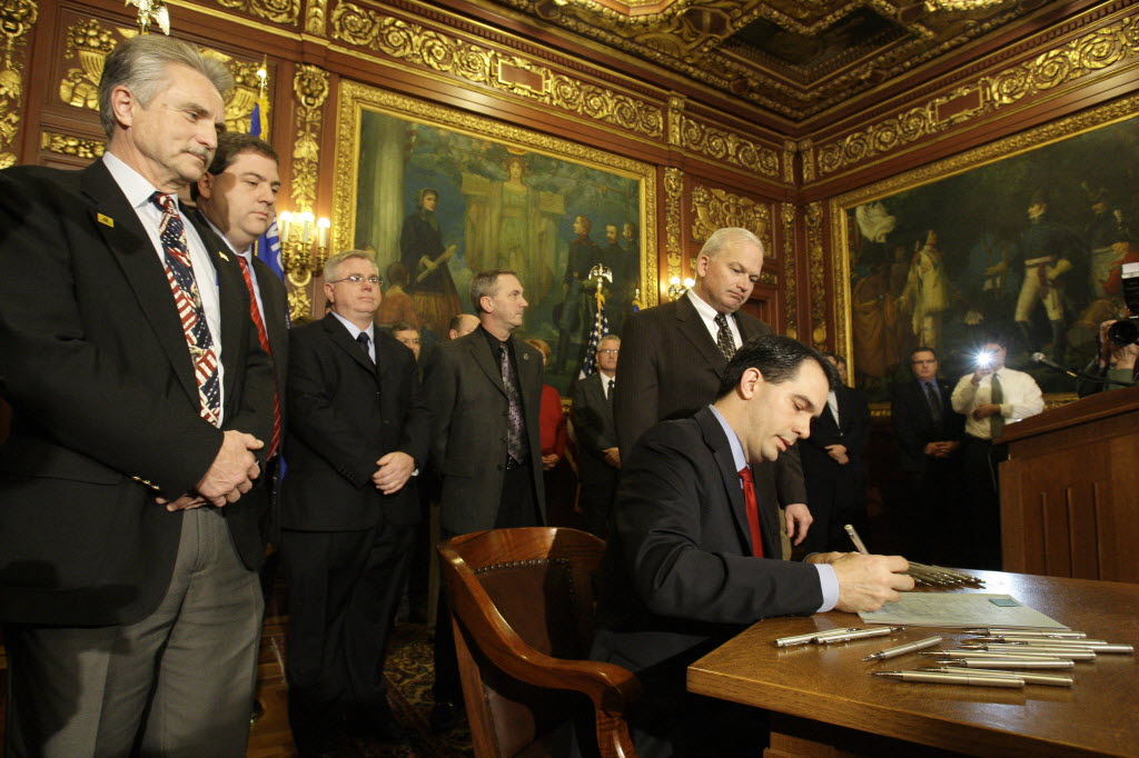 Walker signs Act 10