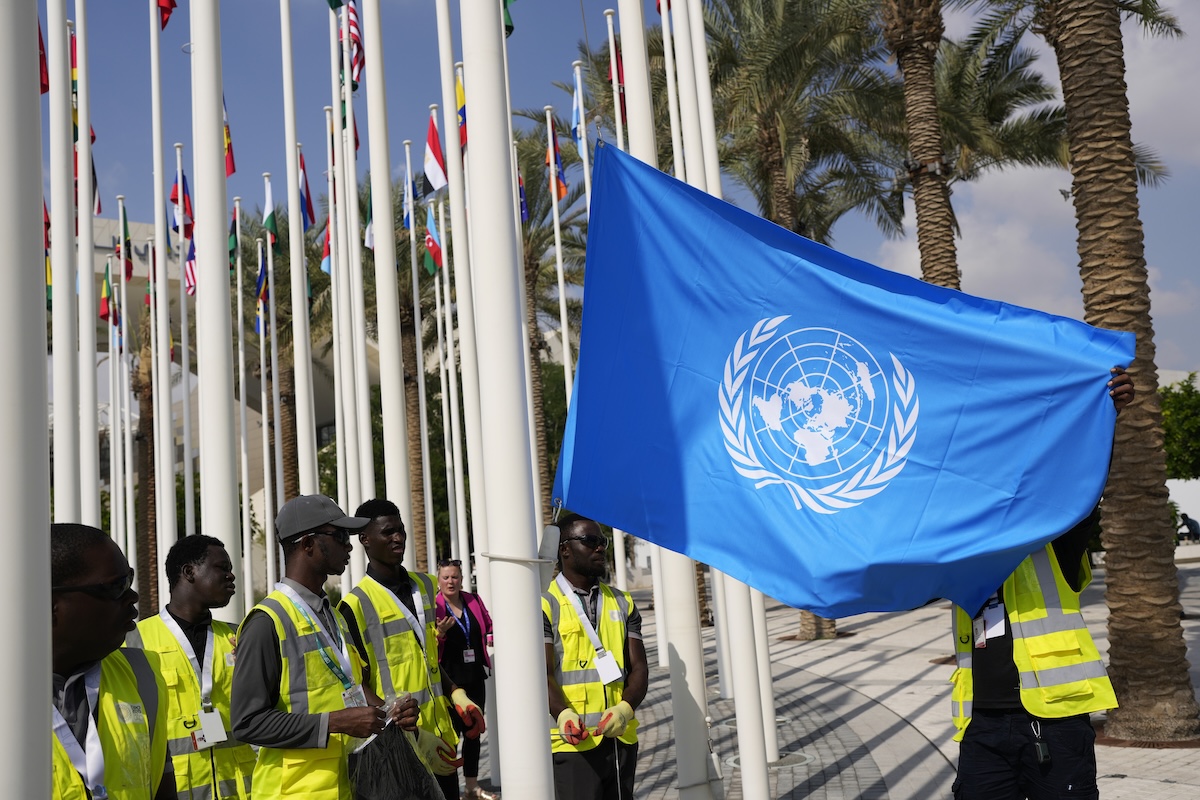 COP 28 UN flag being raised
